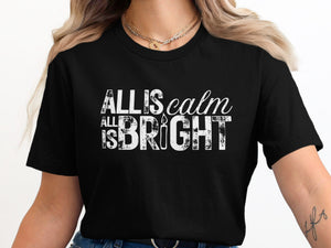 Black t-shirt with white distressed text reading "ALL IS calm ALL IS BRIGHT" and a candle graphic.