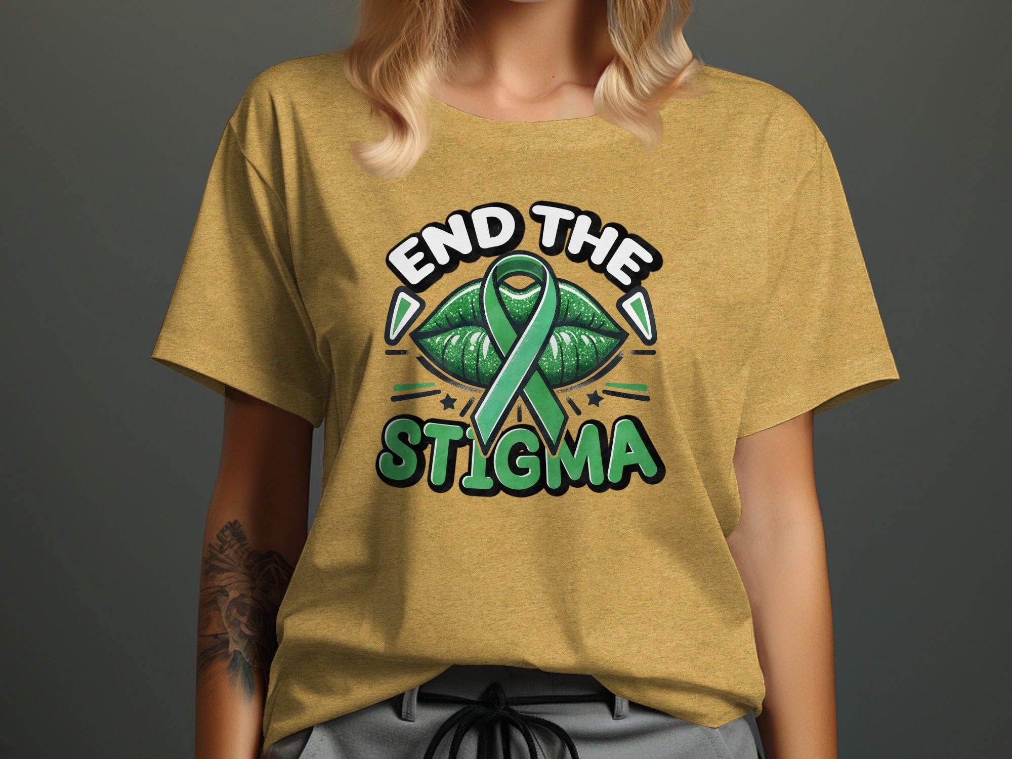 Yellow t-shirt with "END THE STIGMA" text and green ribbon between lips.
