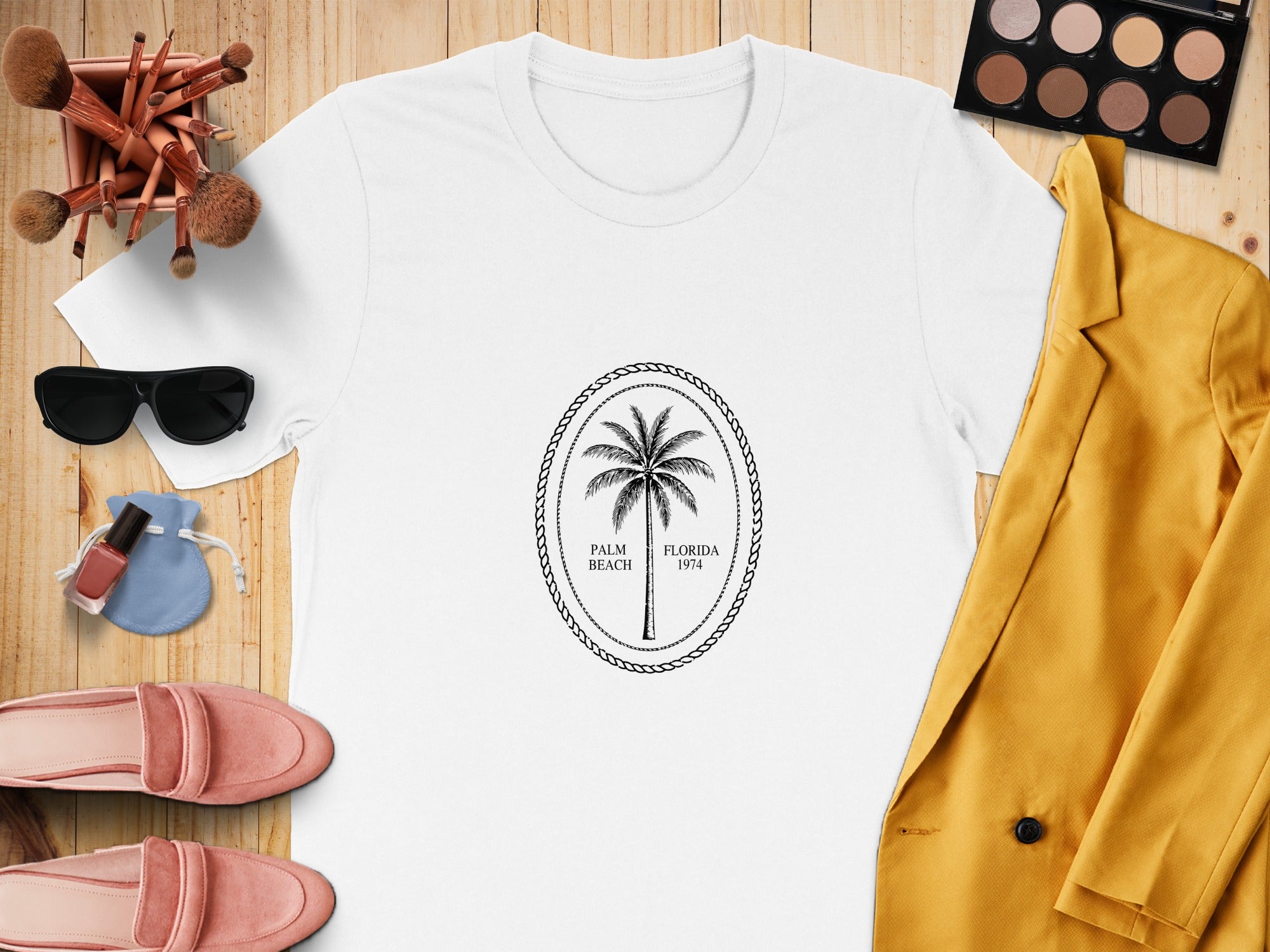 White t-shirt with oval palm tree graphic: Palm Beach, Florida 1974.
