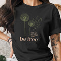 Black t-shirt with dandelions and text "Let go, fly high, and be free."