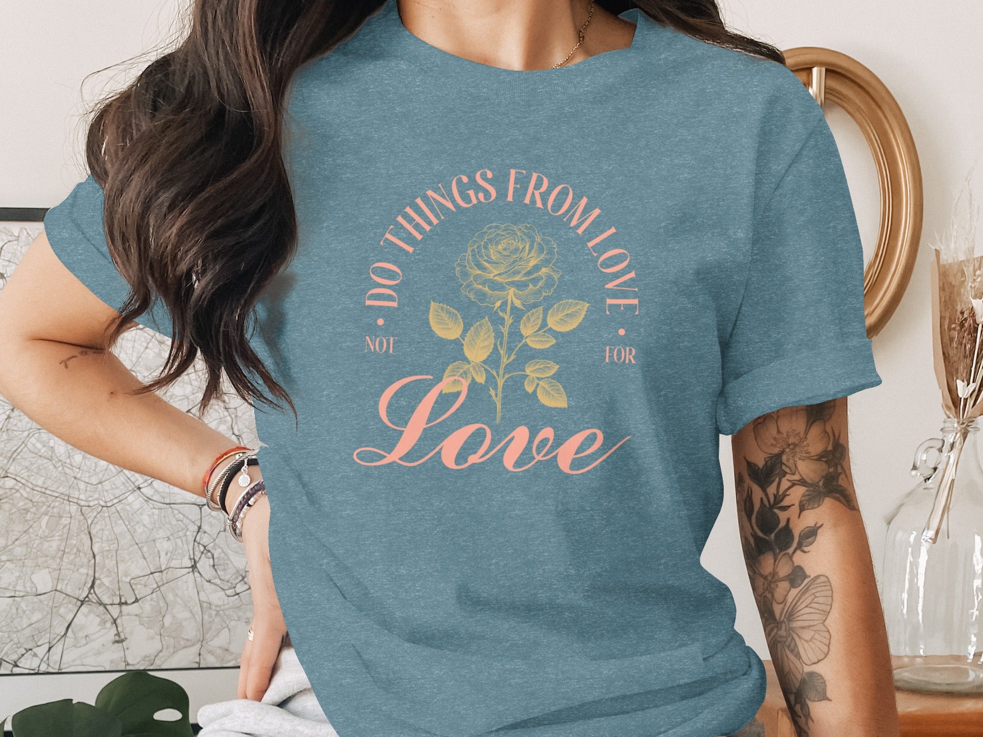 Blue t-shirt with "Do Things From Love Not For" text and rose design.