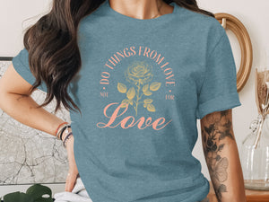 Blue t-shirt with "Do Things From Love Not For" text and rose design.