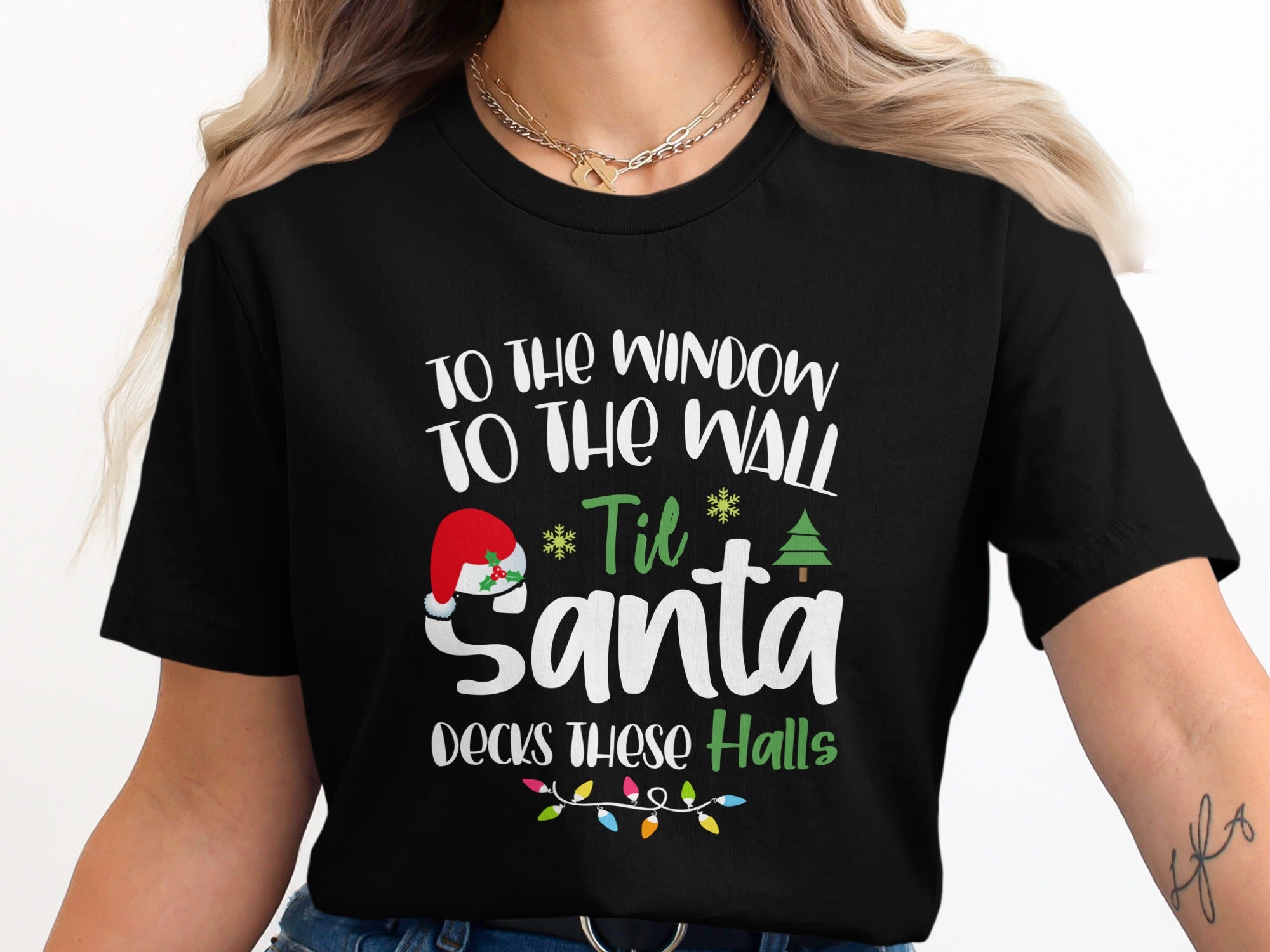 Black t-shirt with "Til Santa decks these halls" Christmas text design