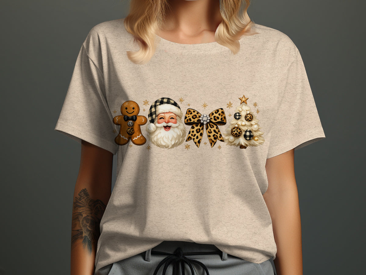 Christmas gingerbread man, Santa, bow, and tree graphic on a light t-shirt.