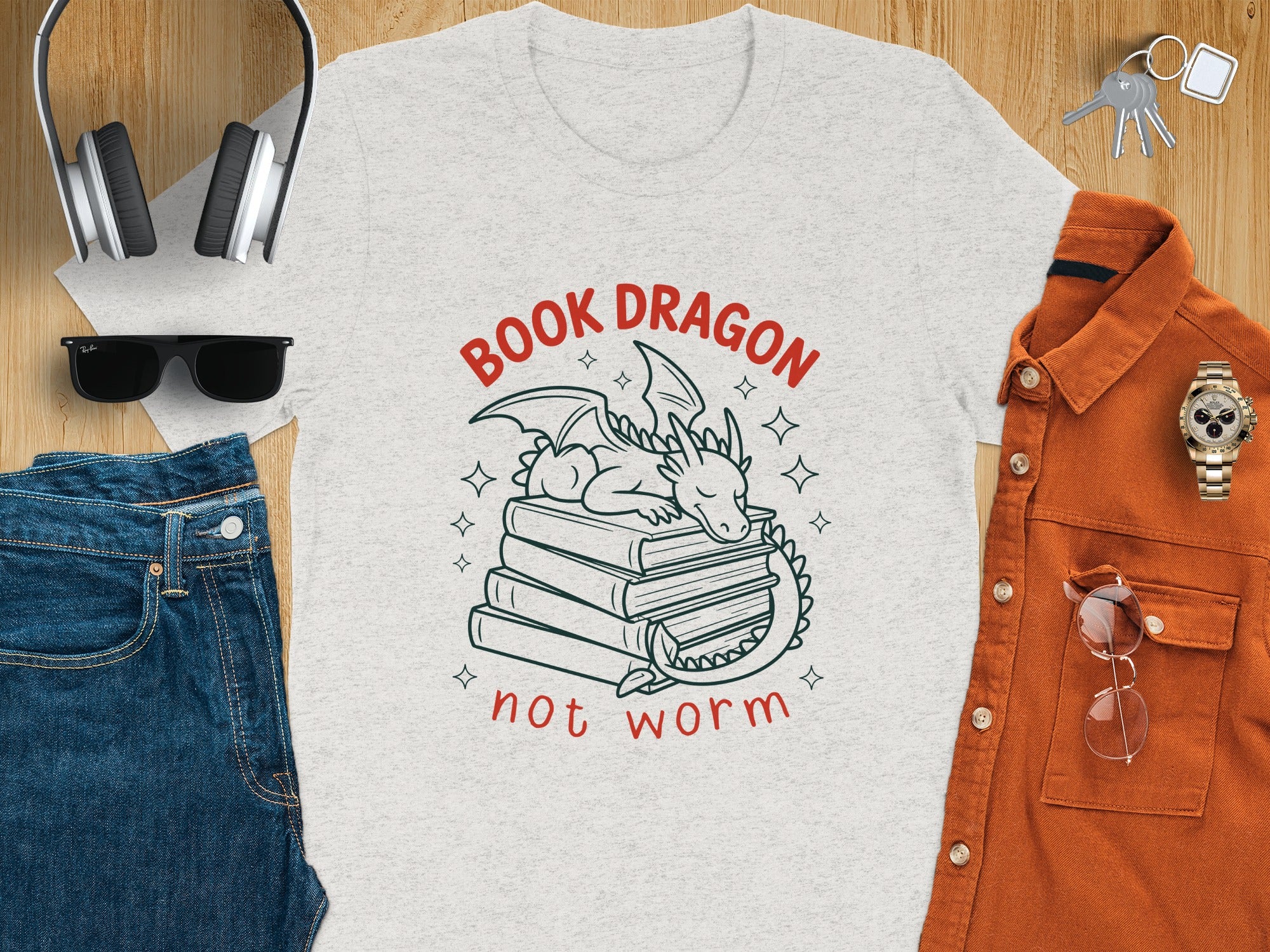 Light gray t-shirt with "Book Dragon not worm" text and a dragon on books graphic.