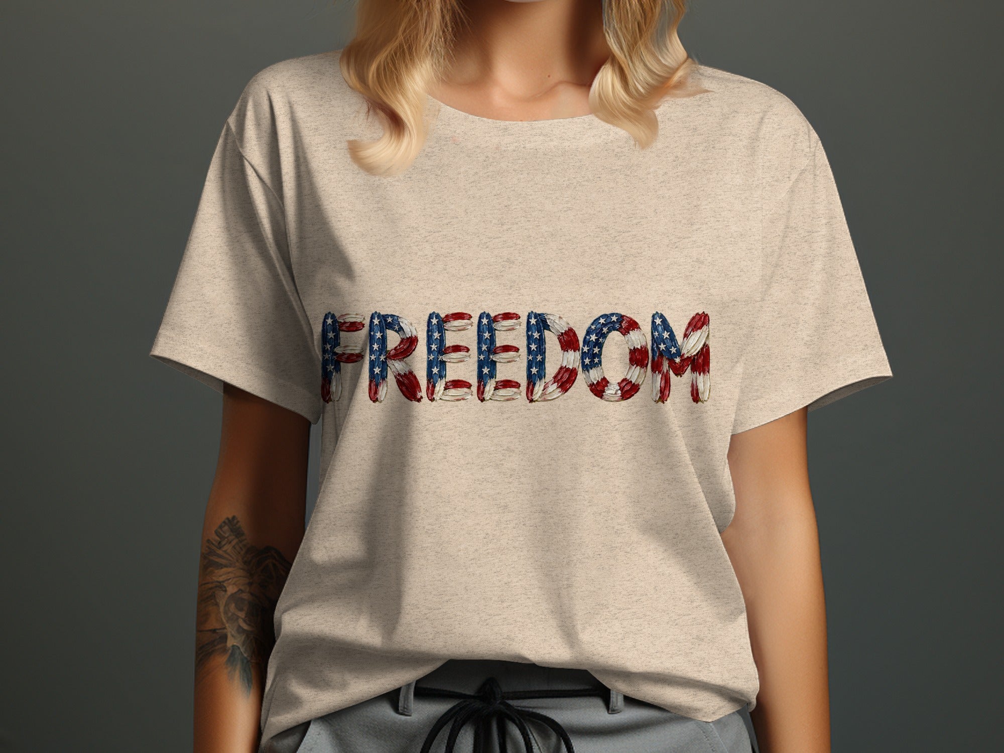 Light beige t-shirt with the word FREEDOM in American flag design.