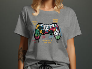 Graffiti-style video game controller graphic with text "Never Give Up", "Press Start", "Level Up", "No", "Yes", "Every Day Is Game Day", and "Game Over".