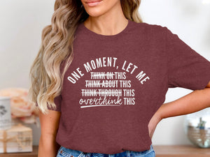 Maroon t-shirt with white text reading "One Moment, Let Me Overthink This".