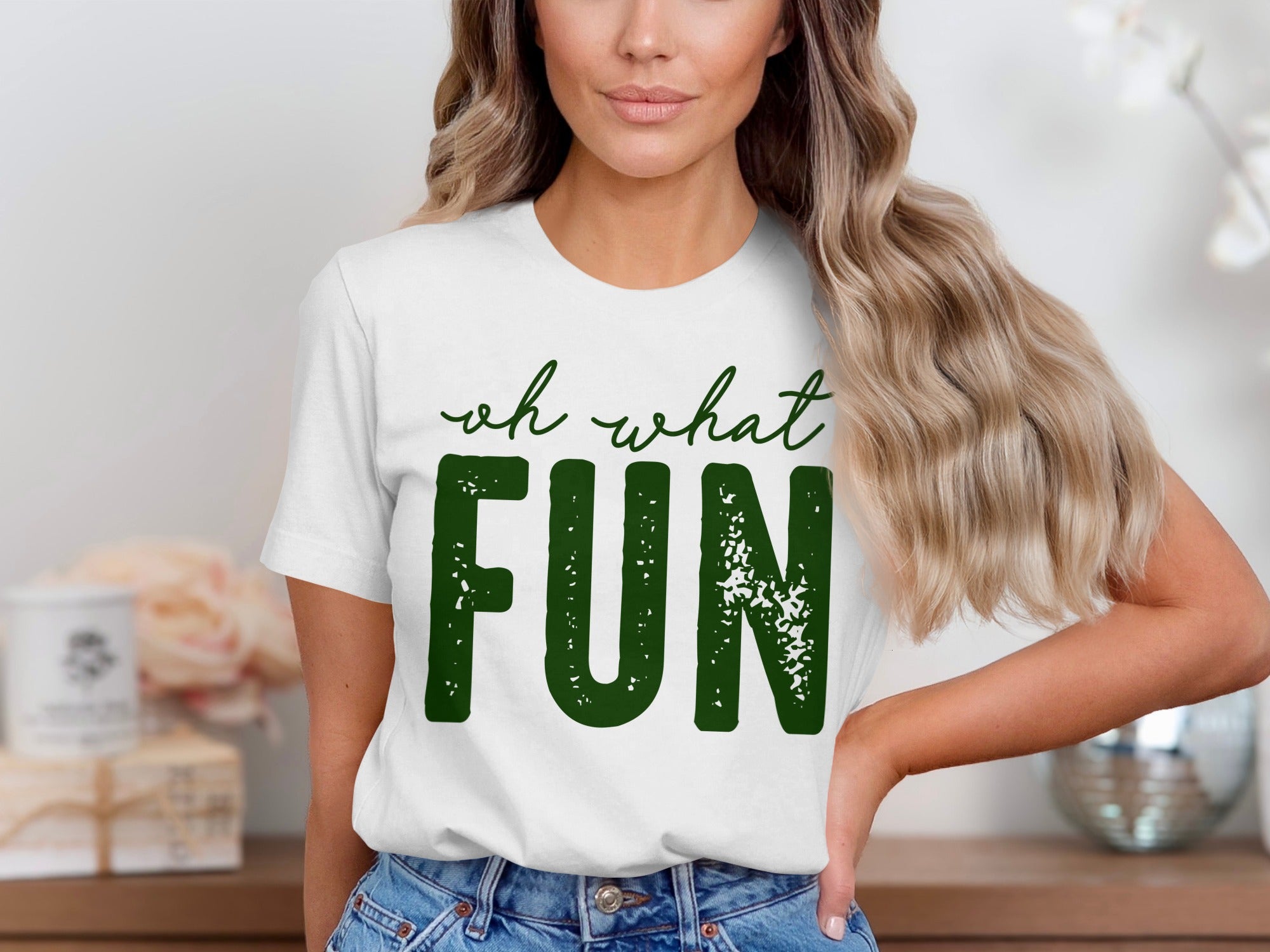 White t-shirt with green text "oh what FUN"