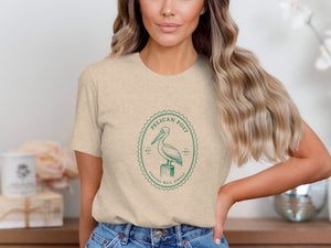 Fitted t-shirt with green Pelican Post logo and coastal mail service text.
