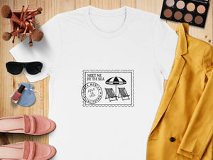 White t-shirt with "Meet Me By The Sea" stamp design featuring Santa Monica, California.