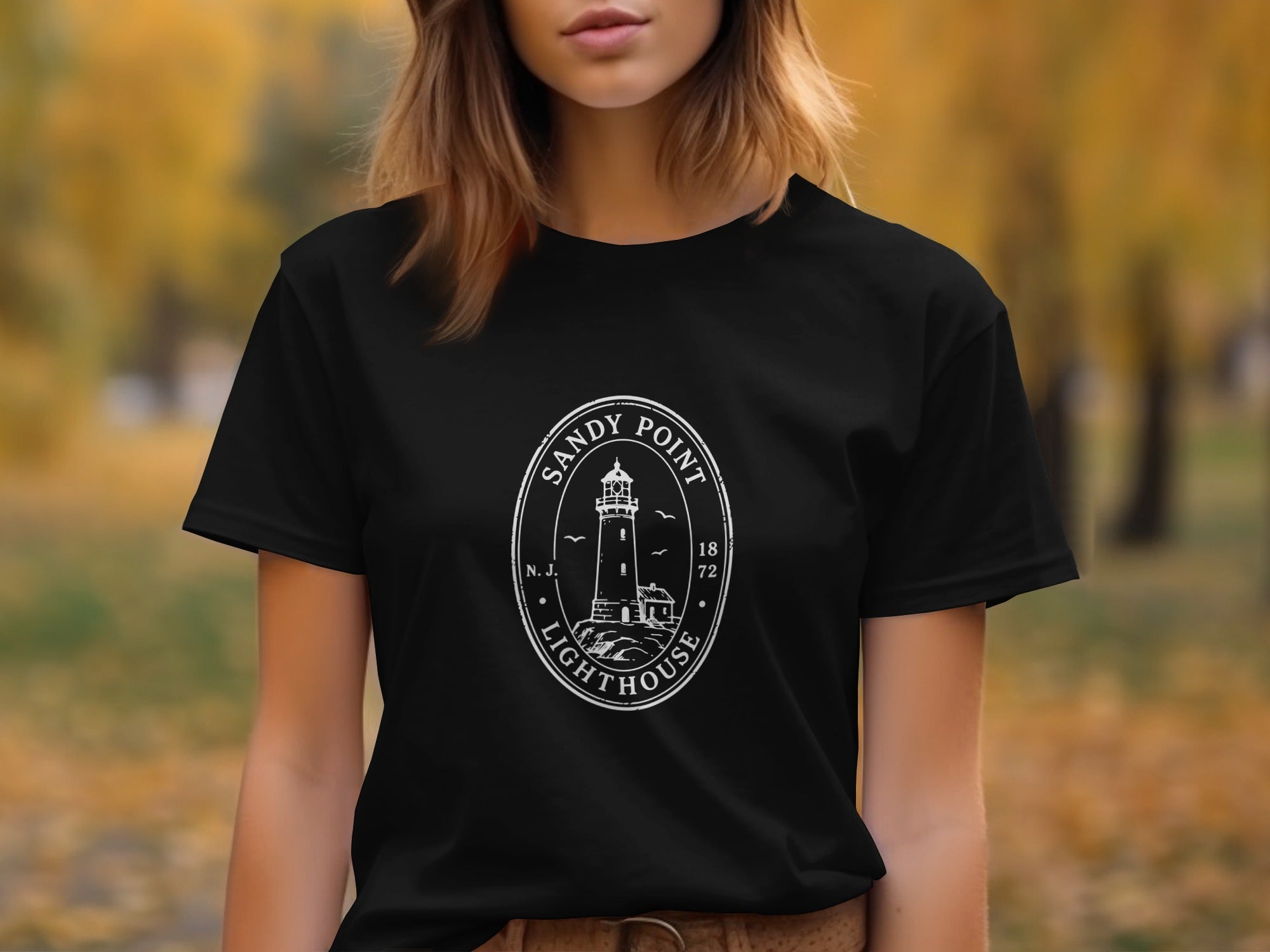 Black t-shirt with white Sandy Point Lighthouse logo featuring N.J. and 1872.