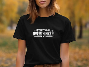 Black t-shirt with white text "PROFESSIONAL OVERTHINKER" and stars.