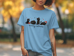 Light blue t-shirt with a Christmas cat graphic and the text "merry catmas."