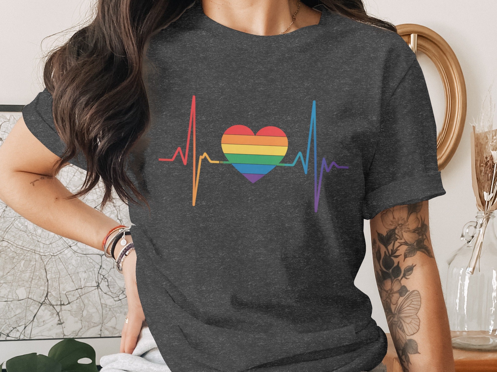 Dark grey t-shirt with rainbow heartbeat and heart graphic.