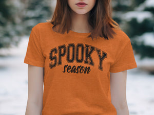 Orange t-shirt with "SPOOKY season" text in distressed black font.