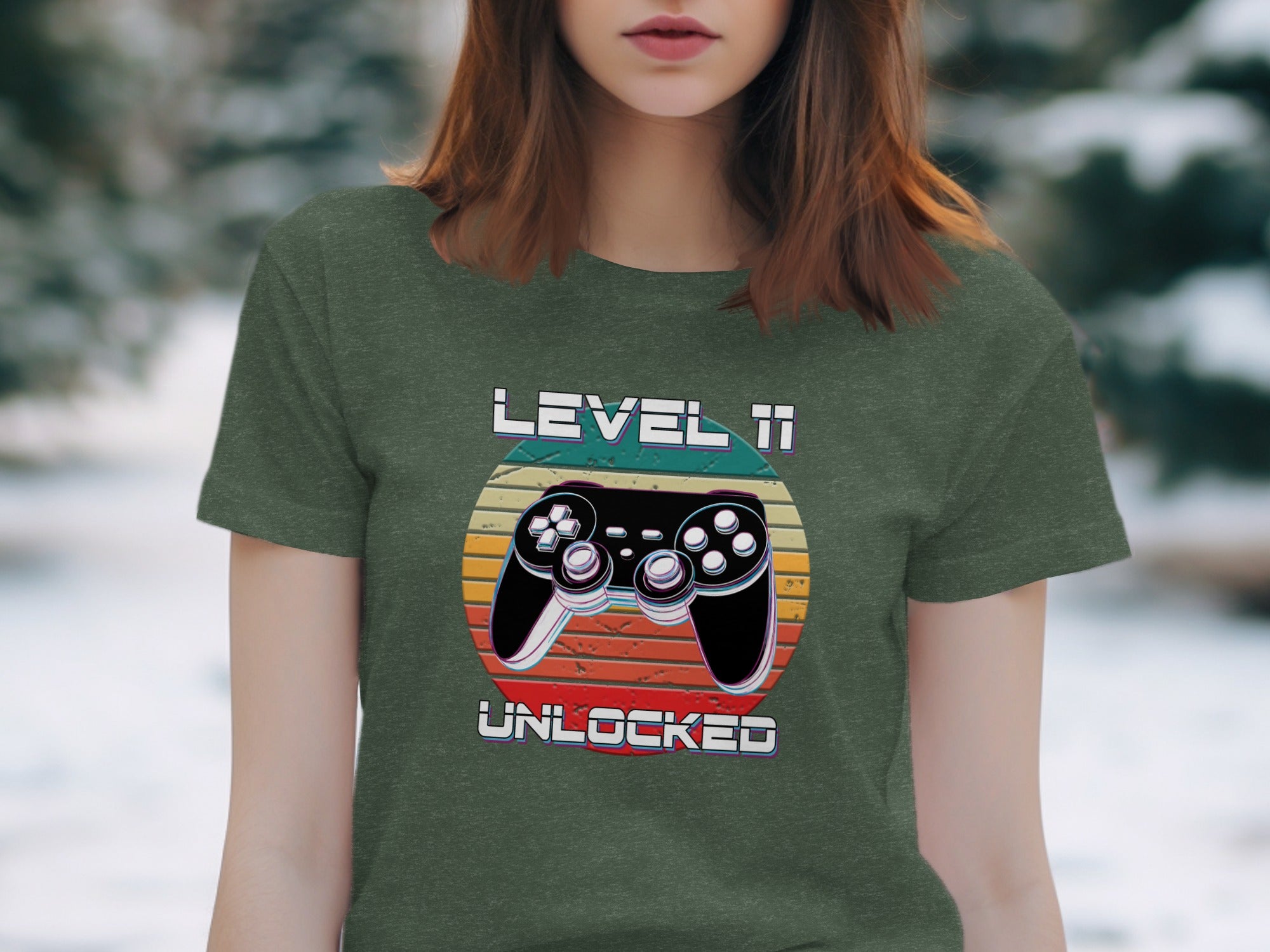 Green t-shirt featuring "LEVEL 11 UNLOCKED" with a video game controller graphic.