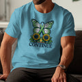 Turquoise t-shirt with green ribbon butterfly, sunflowers, and the word CONTINUE.