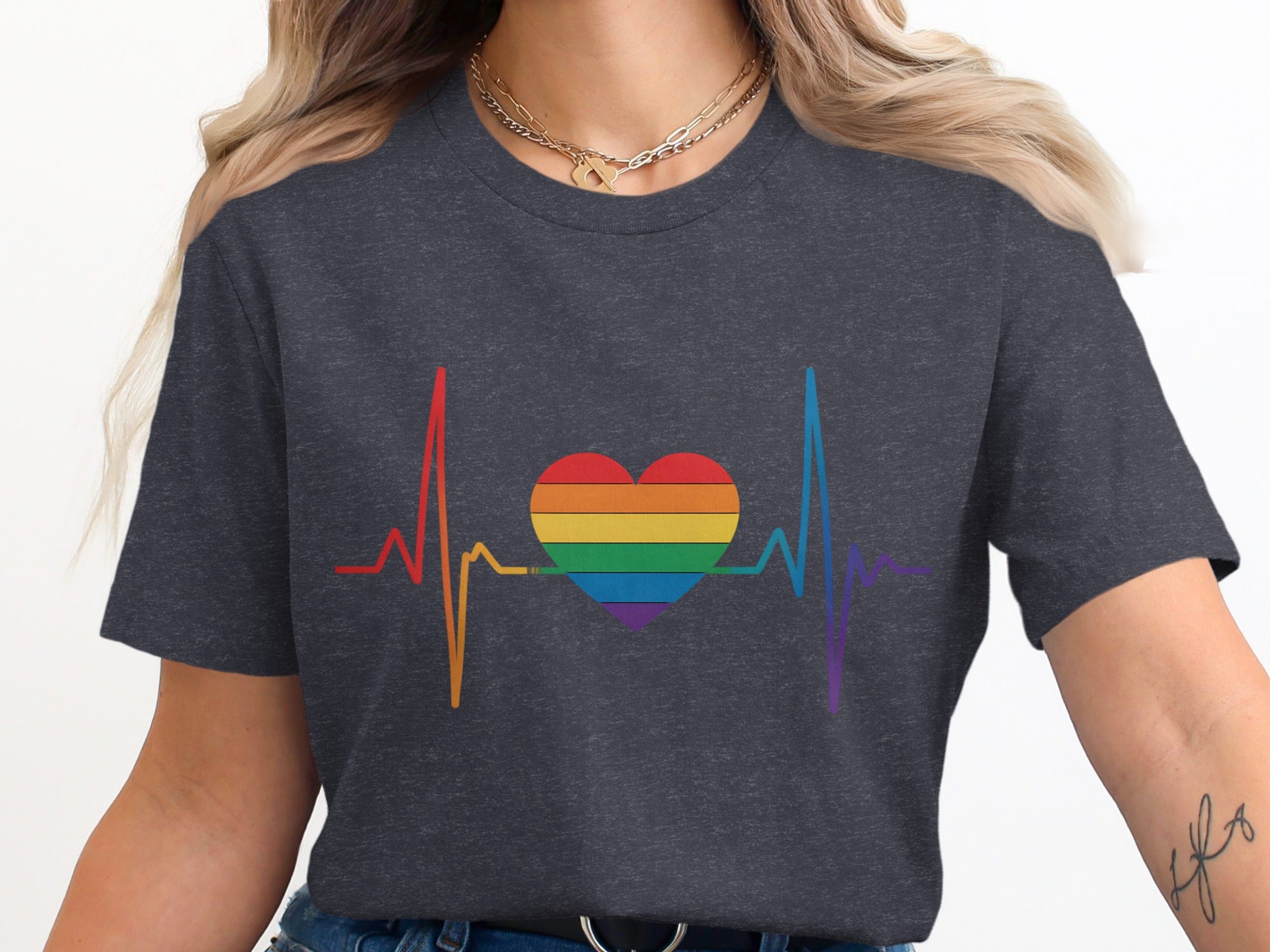 Dark gray t-shirt with rainbow heartbeat and heart graphic.