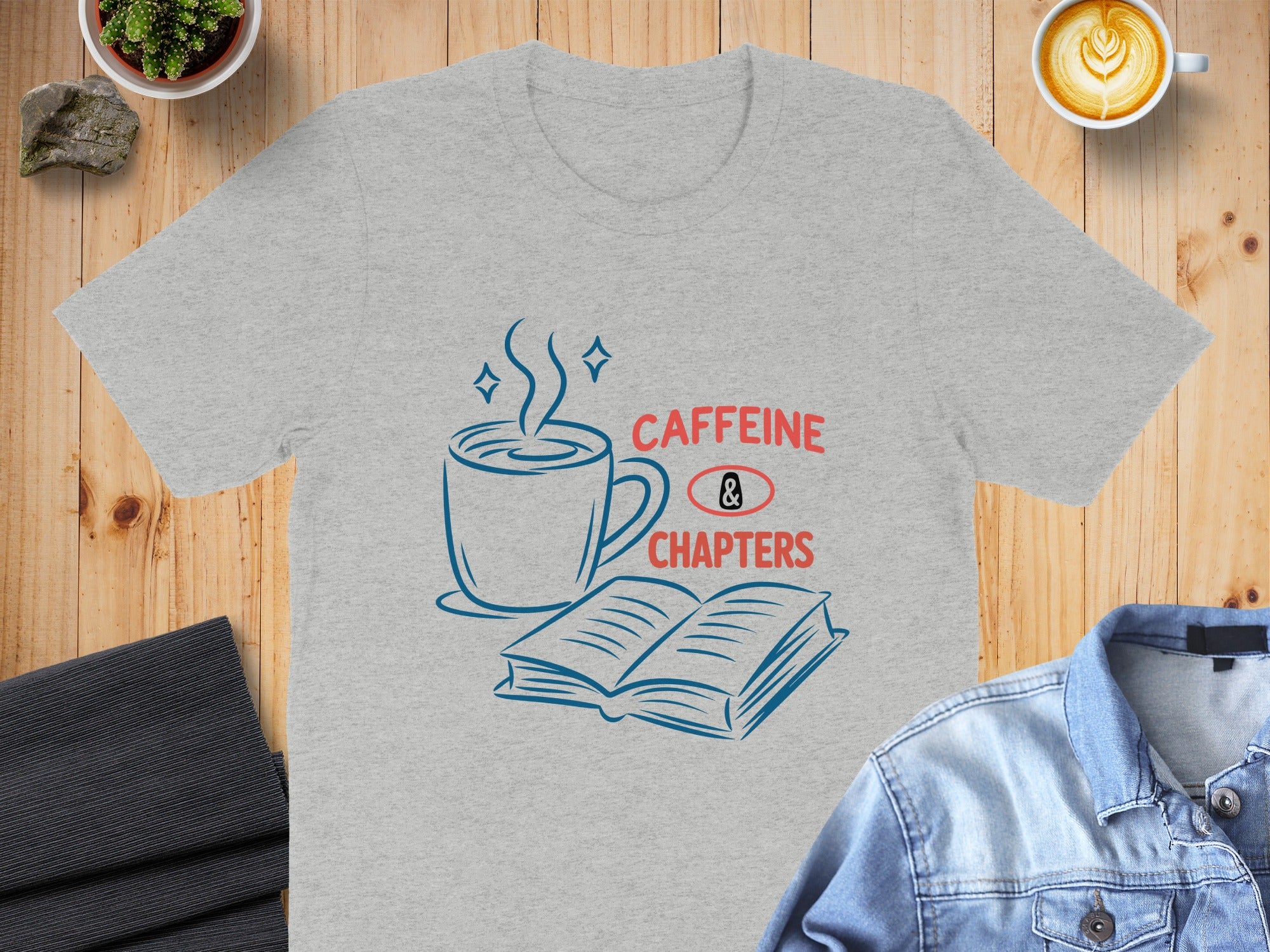 Gray t-shirt with "Caffeine & Chapters" text and coffee cup and book graphic.