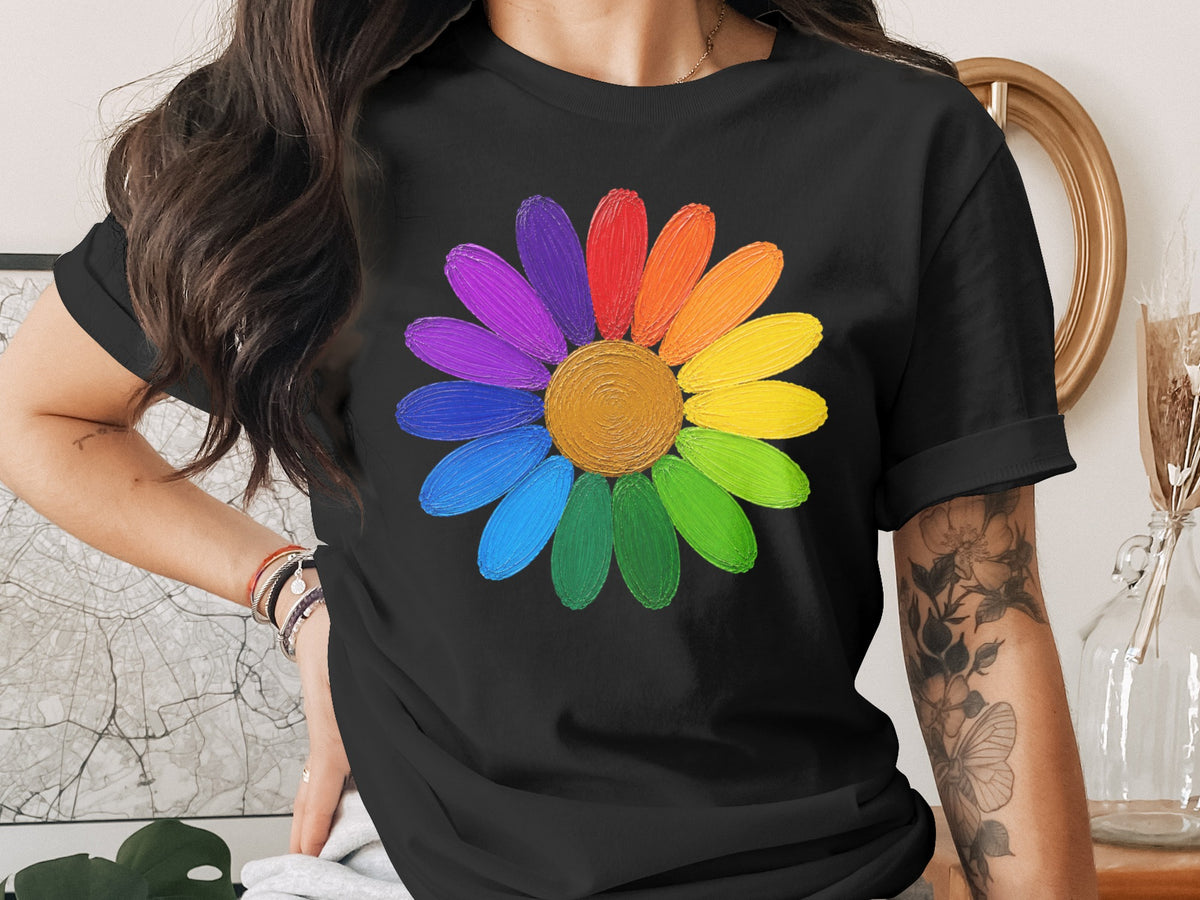 Black t-shirt with a colorful rainbow daisy graphic and a person wearing it.