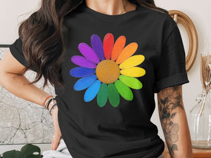 Black t-shirt with a colorful rainbow daisy graphic and a person wearing it.