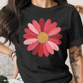 Black t-shirt with a pink and red flower graphic and gold center.