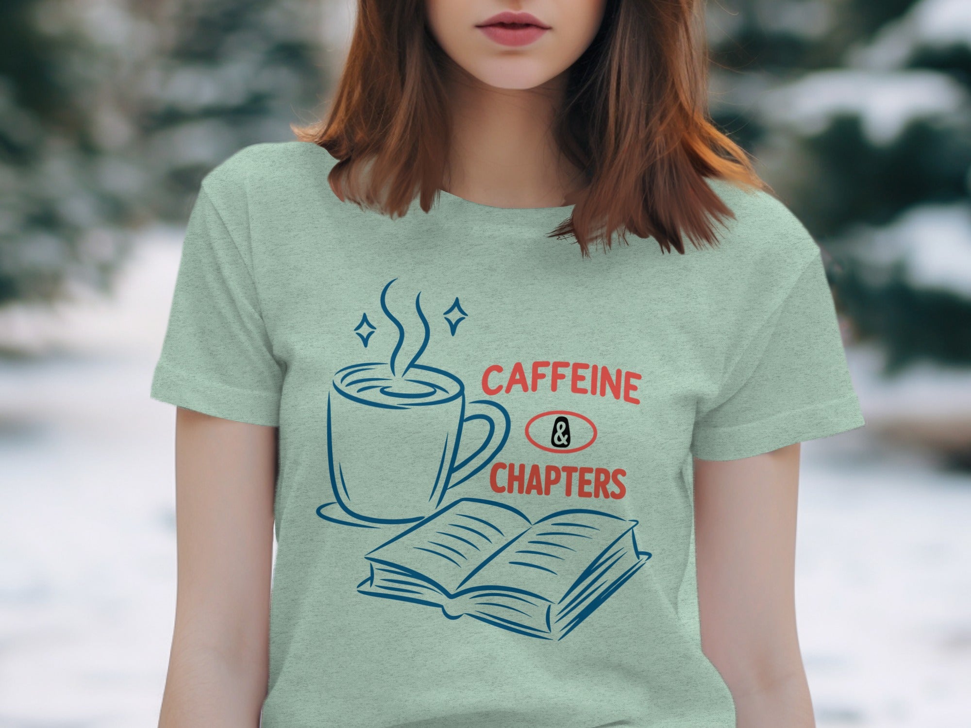 Light blue t-shirt with "CAFFEINE & CHAPTERS" text and coffee cup and book graphic.