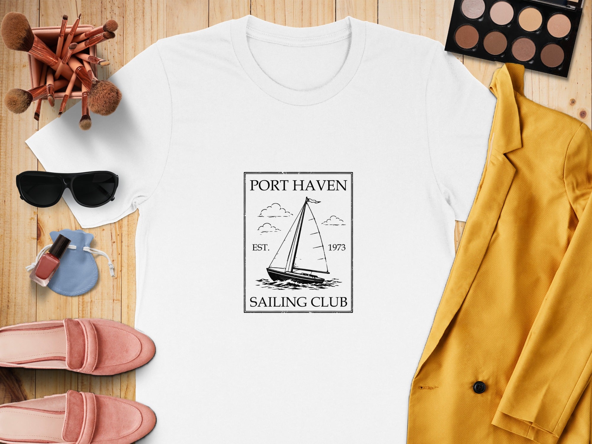 White t-shirt with "Port Haven Sailing Club Est. 1973" sailing design.