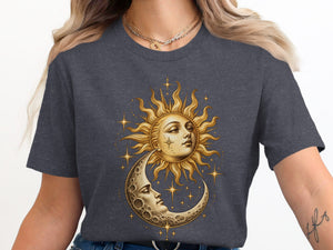 Sun and moon faces with stars graphic on a dark gray t-shirt.