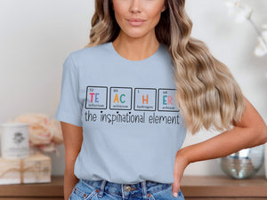 Light blue t-shirt with "TEACHER" spelled using periodic table elements and text "the inspirational element".