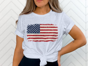 Light gray t-shirt with distressed American flag graphic across chest.
