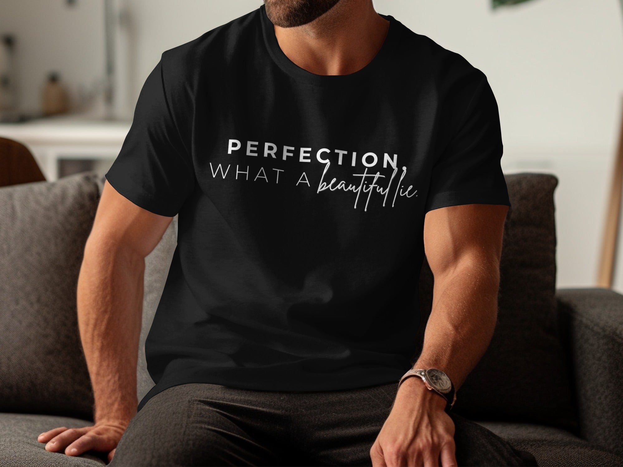 Black t-shirt with white text reading "PERFECTION. WHAT A beautiful lie."