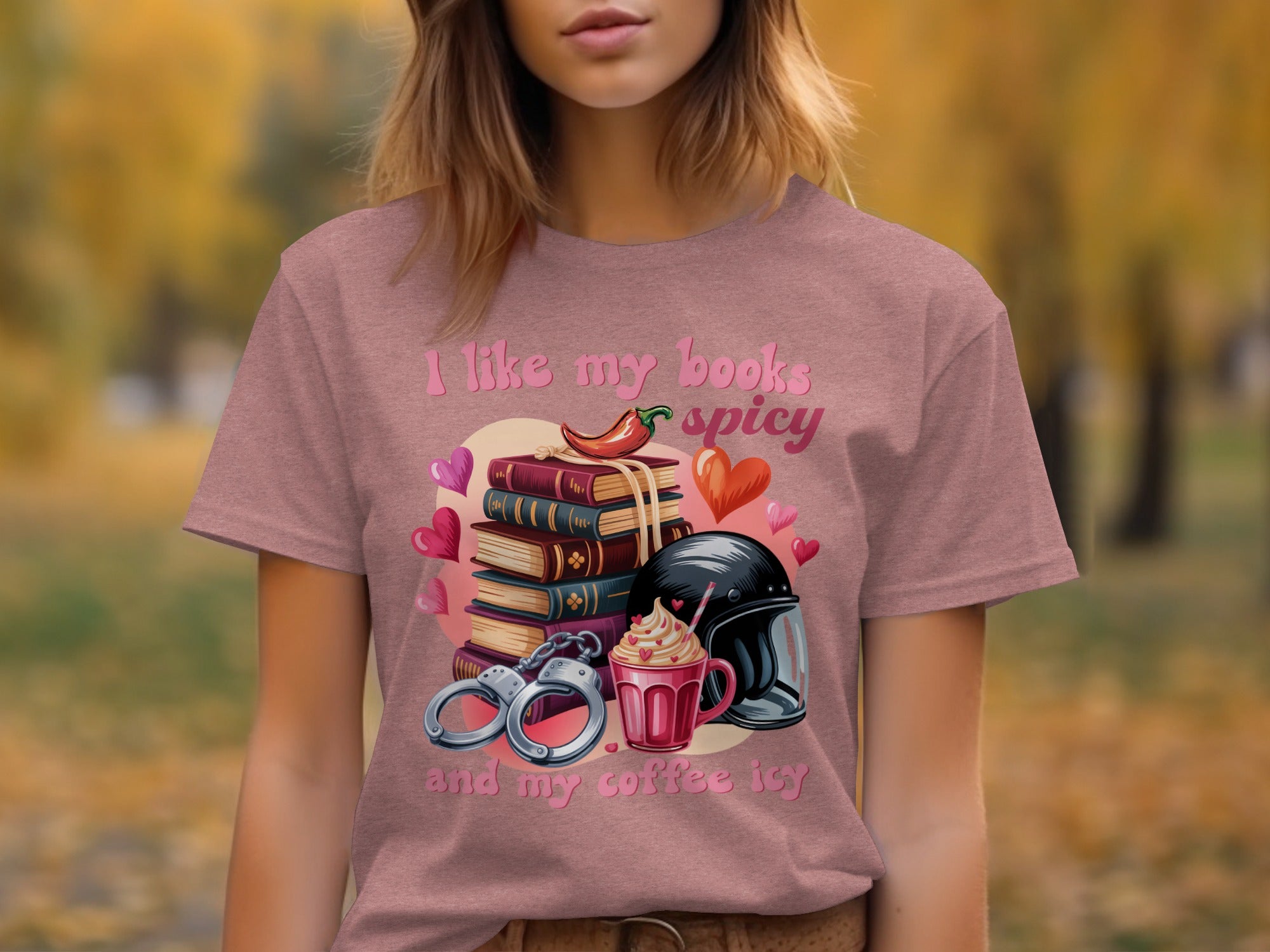 T-shirt graphic with stack of books, chili pepper, handcuffs, iced coffee, and hearts.