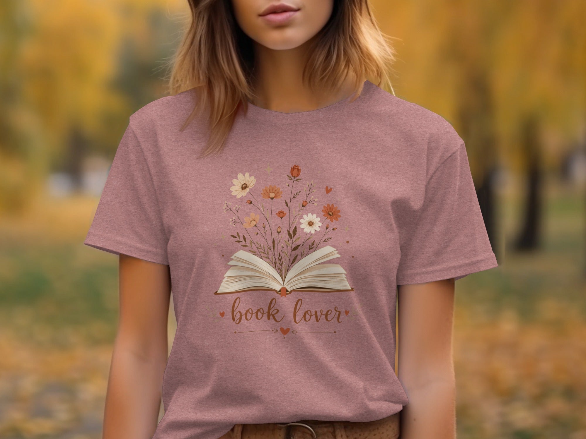 T-shirt with open book and flowers design, text "book lover."