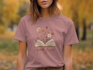 T-shirt with open book and flowers design, text "book lover."