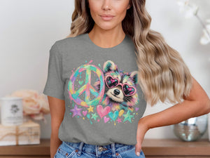 T-shirt with a watercolor-style raccoon wearing heart sunglasses next to a peace sign.