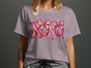 T-shirt with pink "XOXO" graphic featuring hearts and bows.