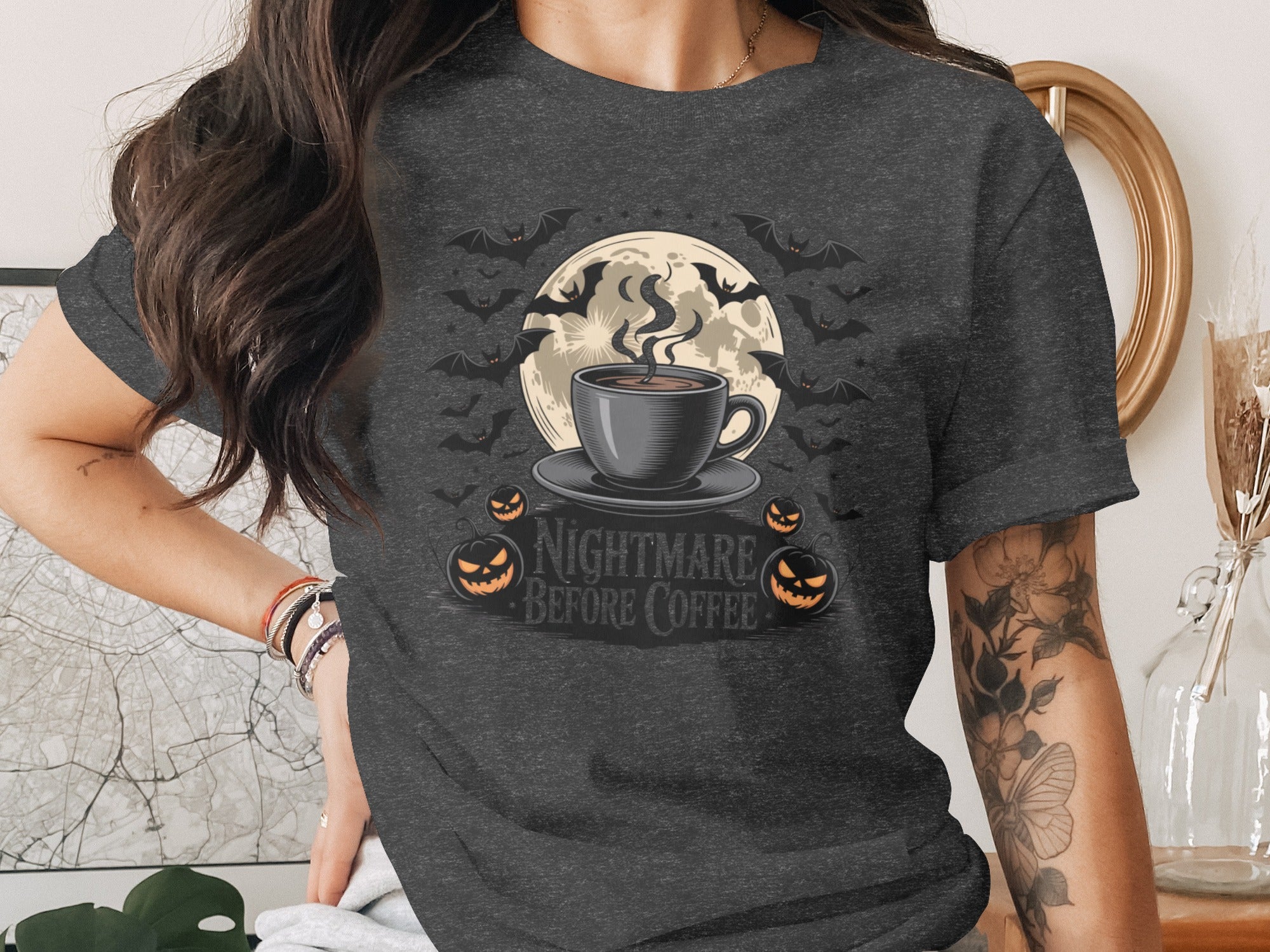 "Nightmare Before Coffee" text with a steaming cup, moon, bats, and pumpkins.