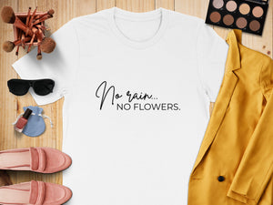 White t-shirt with "No rain... NO FLOWERS." text with accessories.