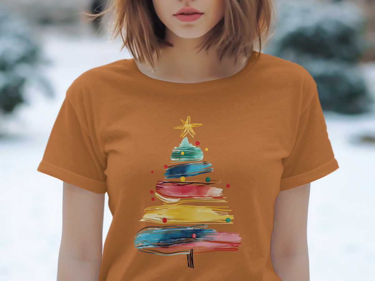 Orange t-shirt with abstract colorful Christmas tree graphic and star.