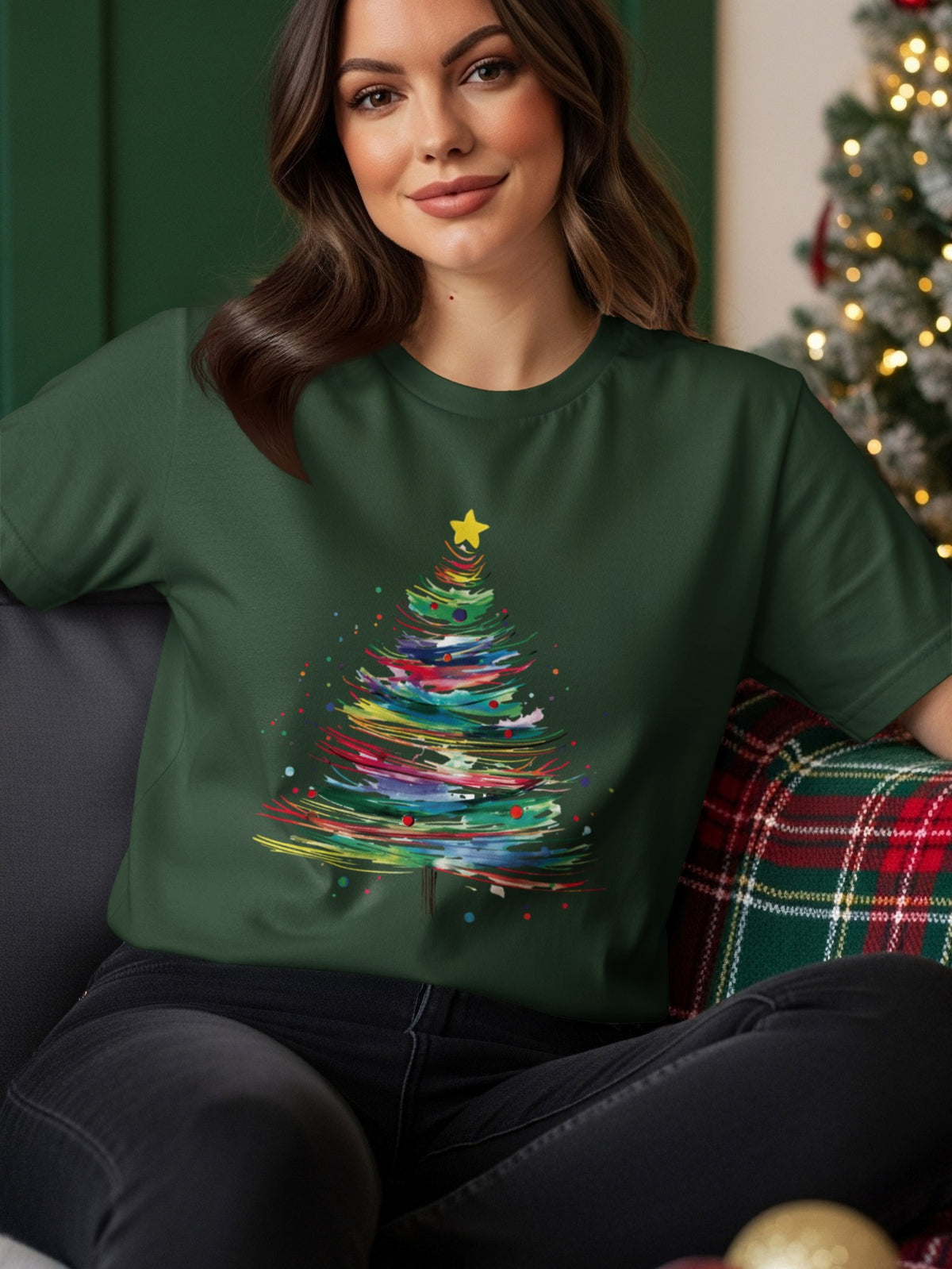 Dark green t-shirt with a colorful abstract Christmas tree graphic and a yellow star.