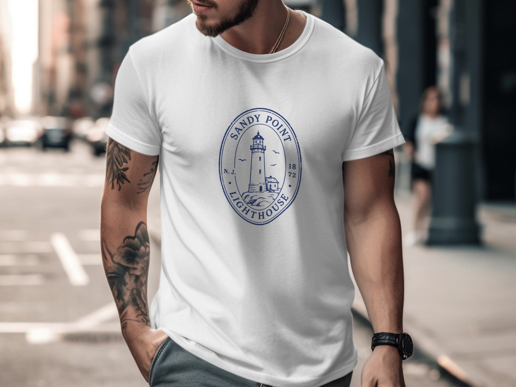 White t-shirt with blue Sandy Point Lighthouse graphic and established date.