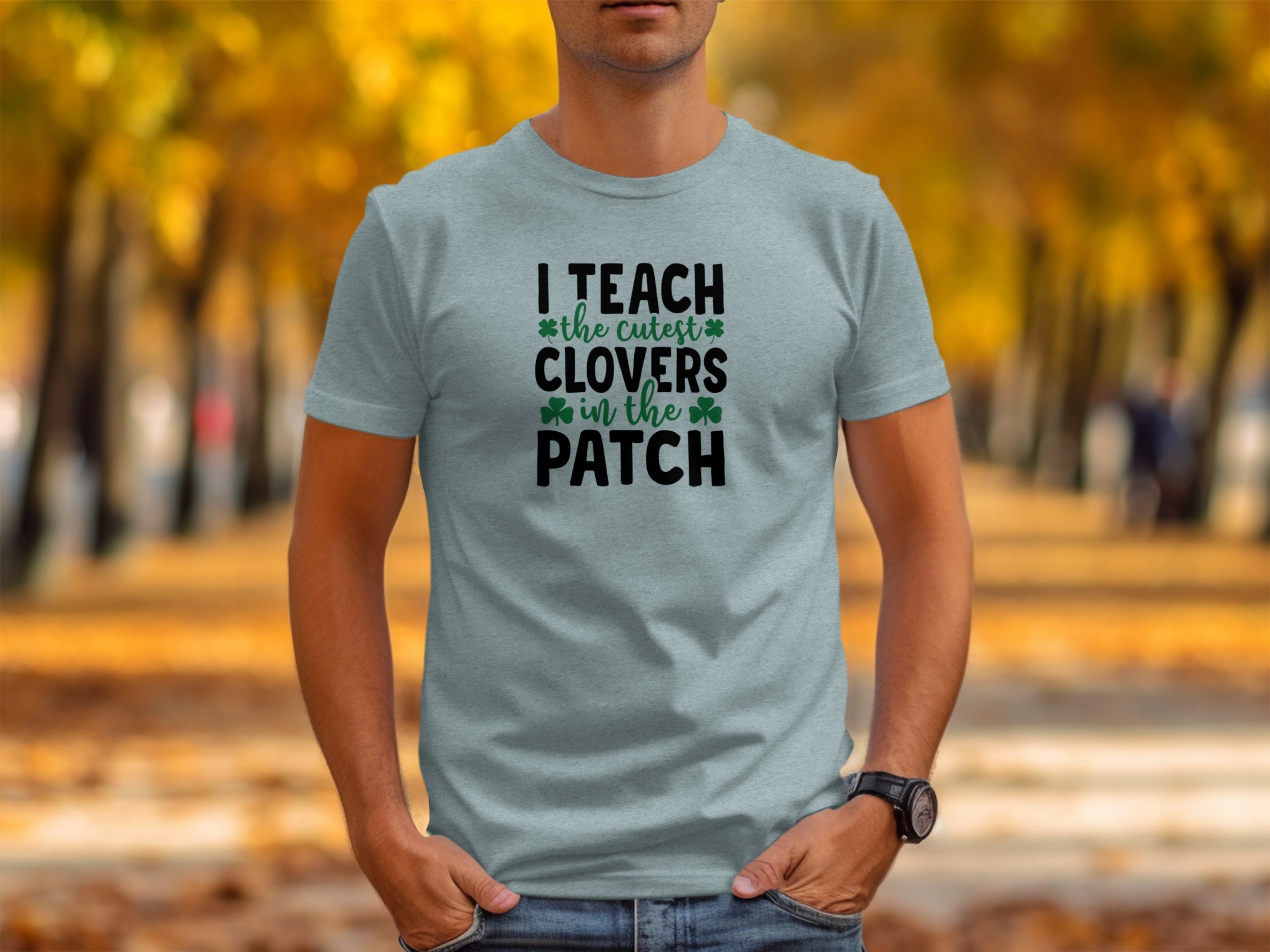 Light blue t-shirt with text "I TEACH the cutest CLOVERS in the PATCH".