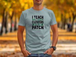 Light blue t-shirt with text "I TEACH the cutest CLOVERS in the PATCH".