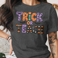 Dark gray t-shirt with "Trick or Teach" Halloween graphic featuring pumpkins and bats.