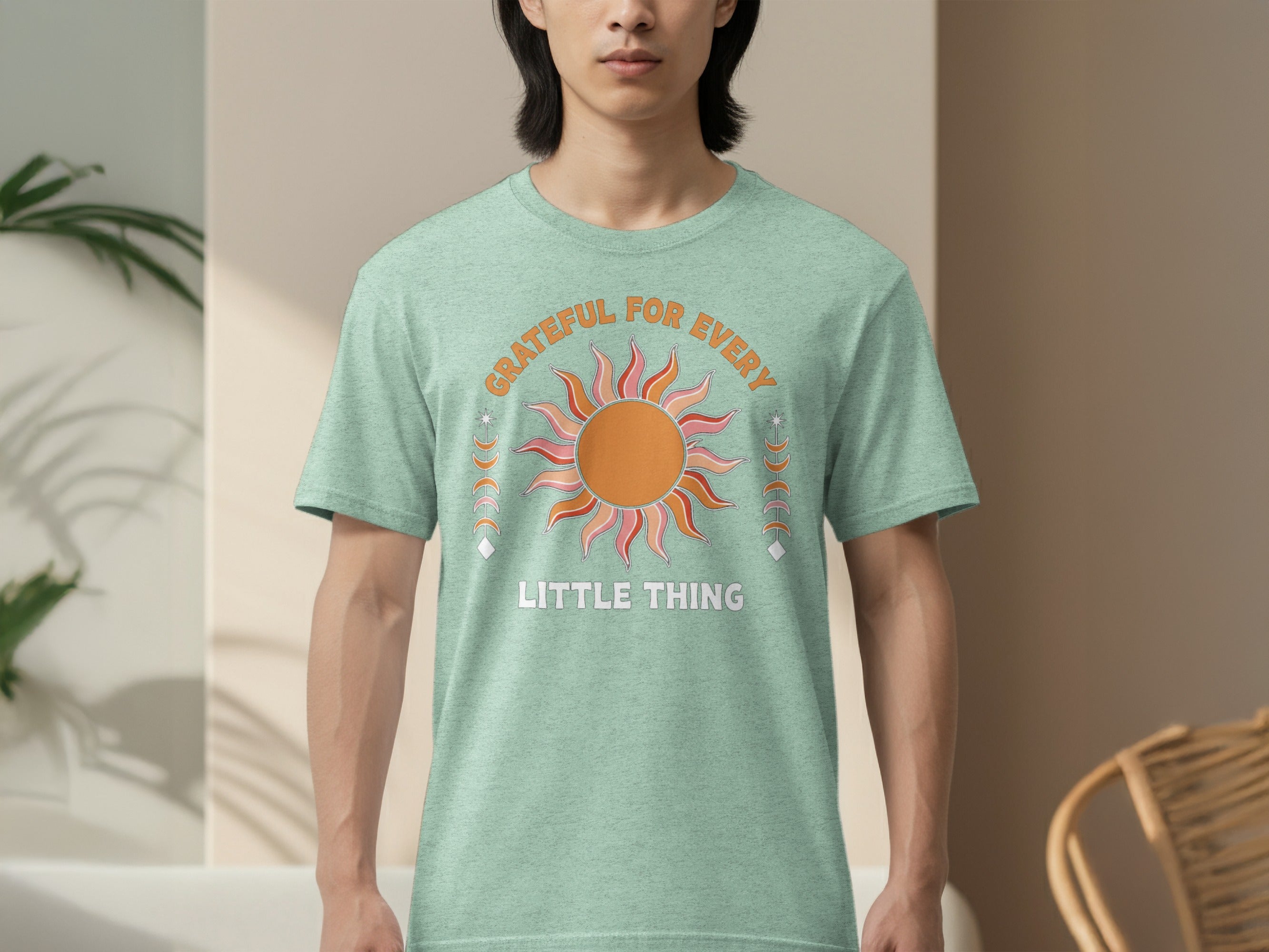 T-shirt with sun graphic and text "GRATEFUL FOR EVERY LITTLE THING."