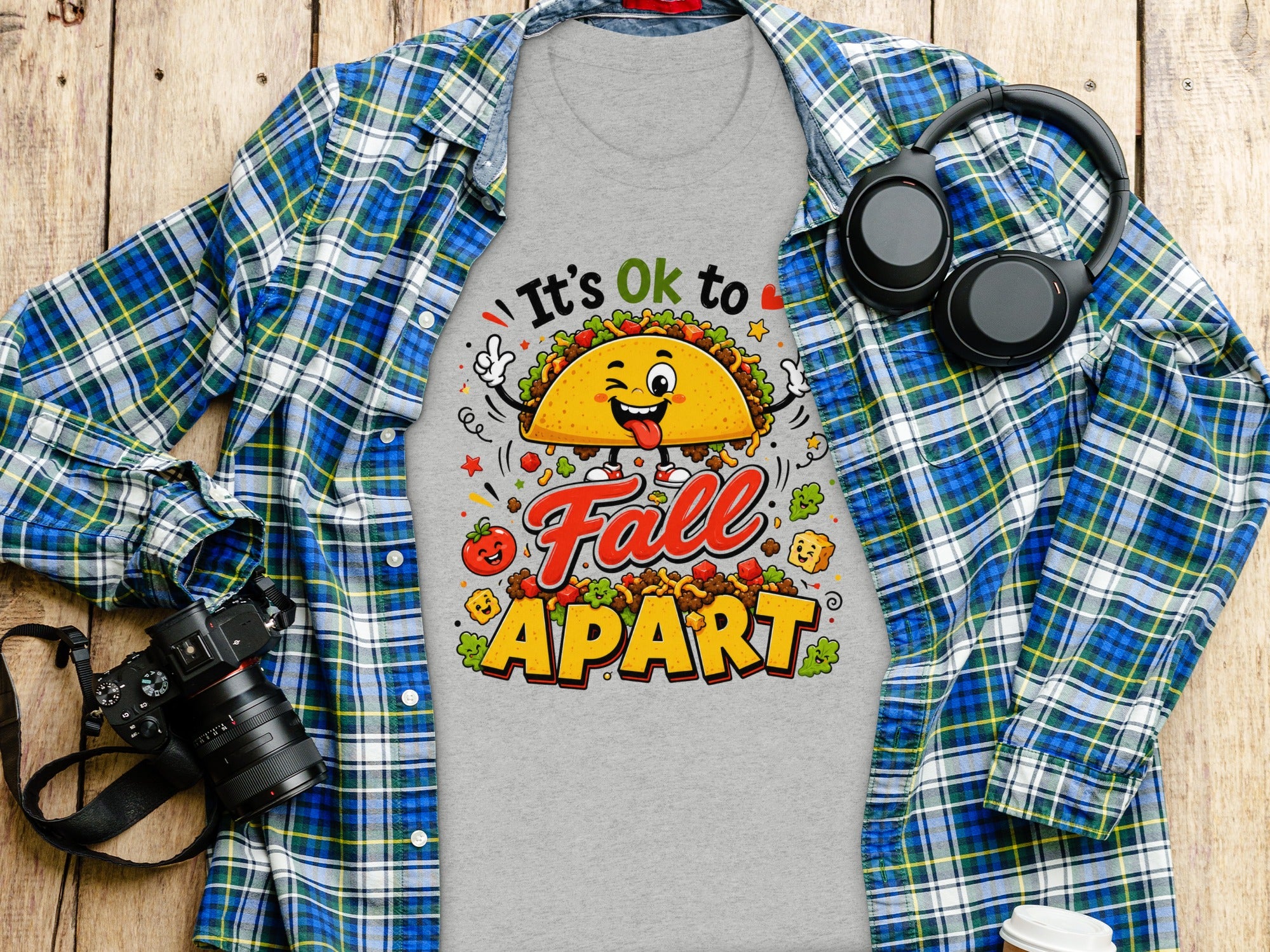 Grey t-shirt with "It's Ok to Fall Apart" text and cartoon taco graphic.