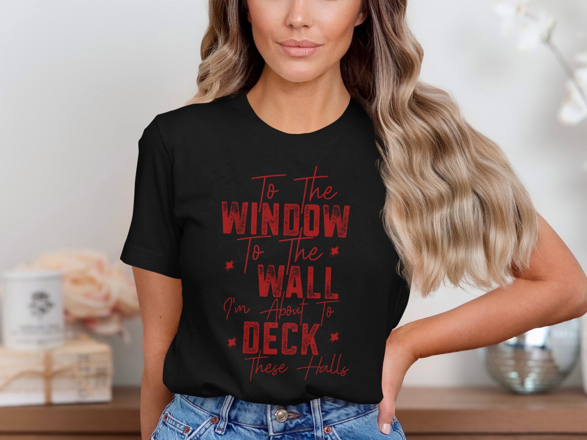 Black t-shirt with red text reading "To The WINDOW To The WALL I'm About To DECK These Halls."