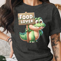 Cartoon alligator holding a sign that reads "FOOD LOVER".